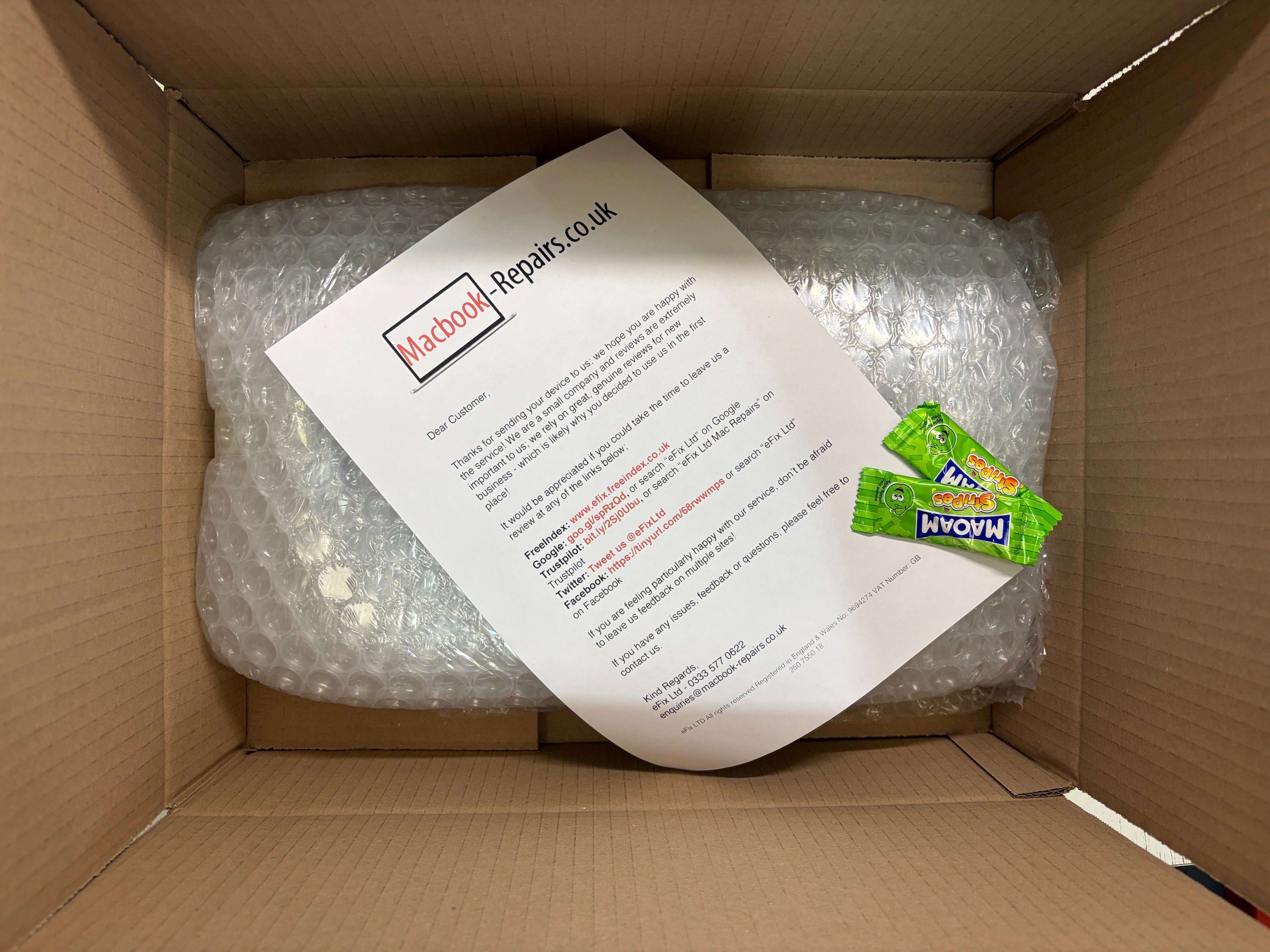 Repaired MacBook being packed up to be shipped out